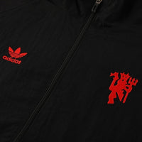 Manchester United tuulitakki 2025/26 - Musta